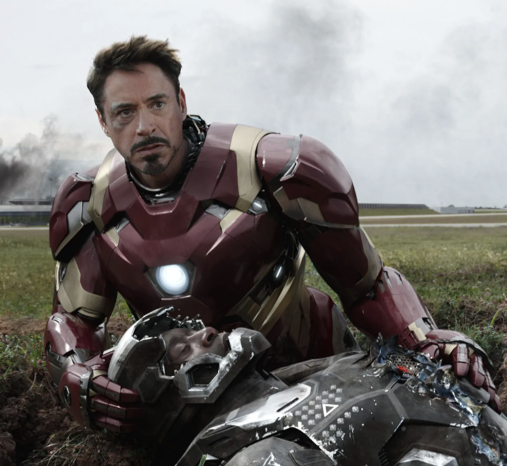 (Ironman in Civil War) Tony Stark was based off of millionaire industrialist Howard Hughes. Stark has a piece of shrapnel near his heart. His magnetic chest plate keeps the shrapnel from reaching his heart and killing him. He must recharge the chest plate every day or die. He also built specialized suits for other environments like deep sea diving and space travel. He graduated from MIT with multiple degrees when he was 21 years old. He is friends with Captain America. Robert Downey Jr. played Iron Man in the movie version.